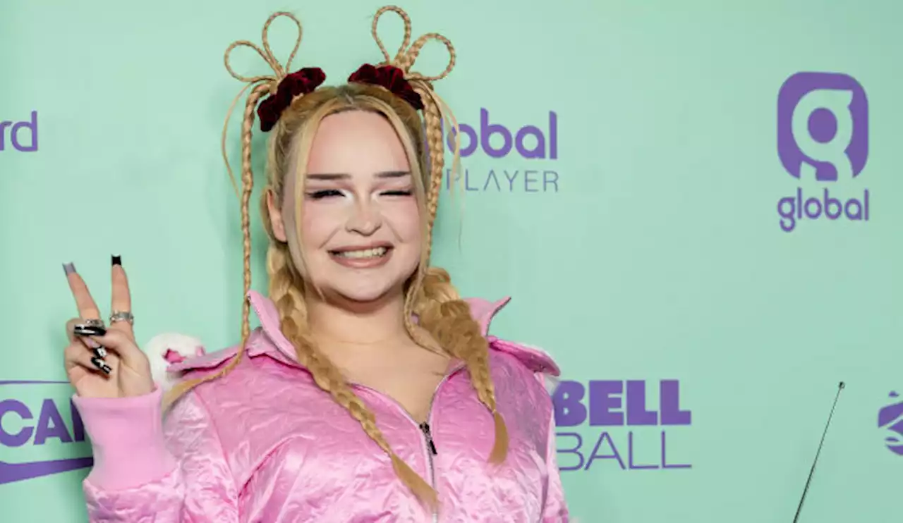 Kim Petras Gets Festive With ‘Cindy Lou Who’ Hair and Pom Pom Coat at Capital Jingle Bell Ball 2022