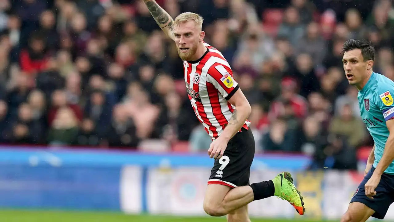 Sheffield United striker Ollie McBurnie acquitted of stamping on pitch-invading fan