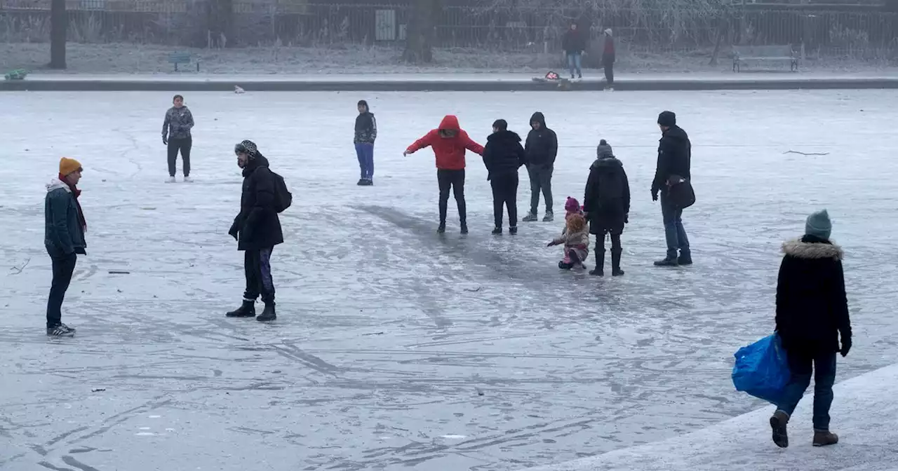 Council staff break ice around city ponds to stop public playing on frozen water