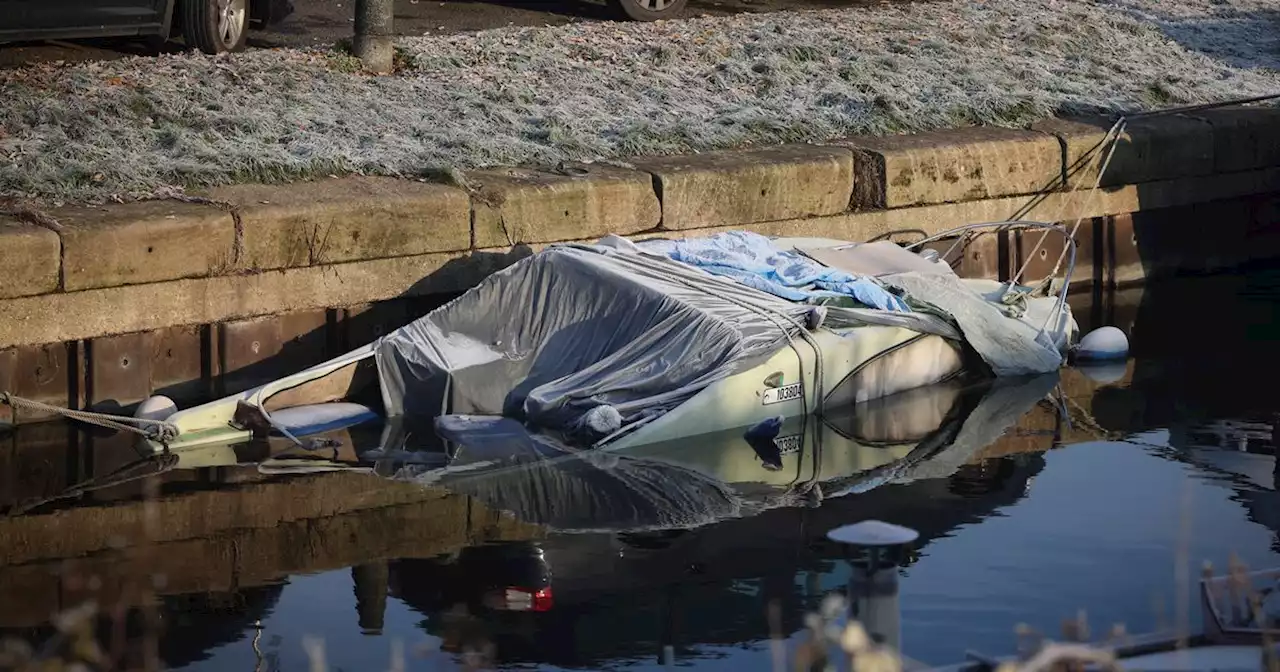 Boat sinks in canal as spell of Arctic weather continues