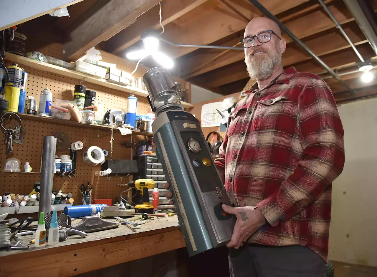 How vacuum cleaners get new life as robots: Batavia man creates art out of others' junk