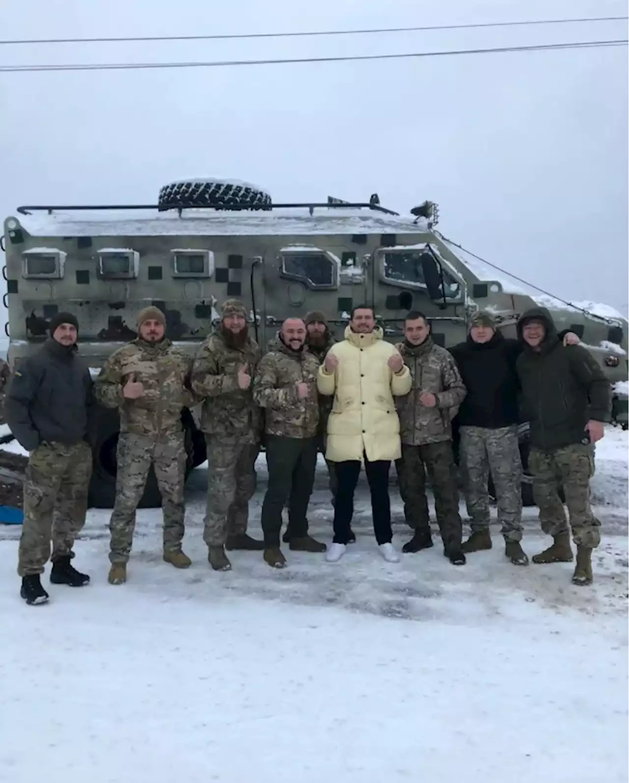 Oleksandr Usyk visits Ukrainian soldiers and poses on top of a tank