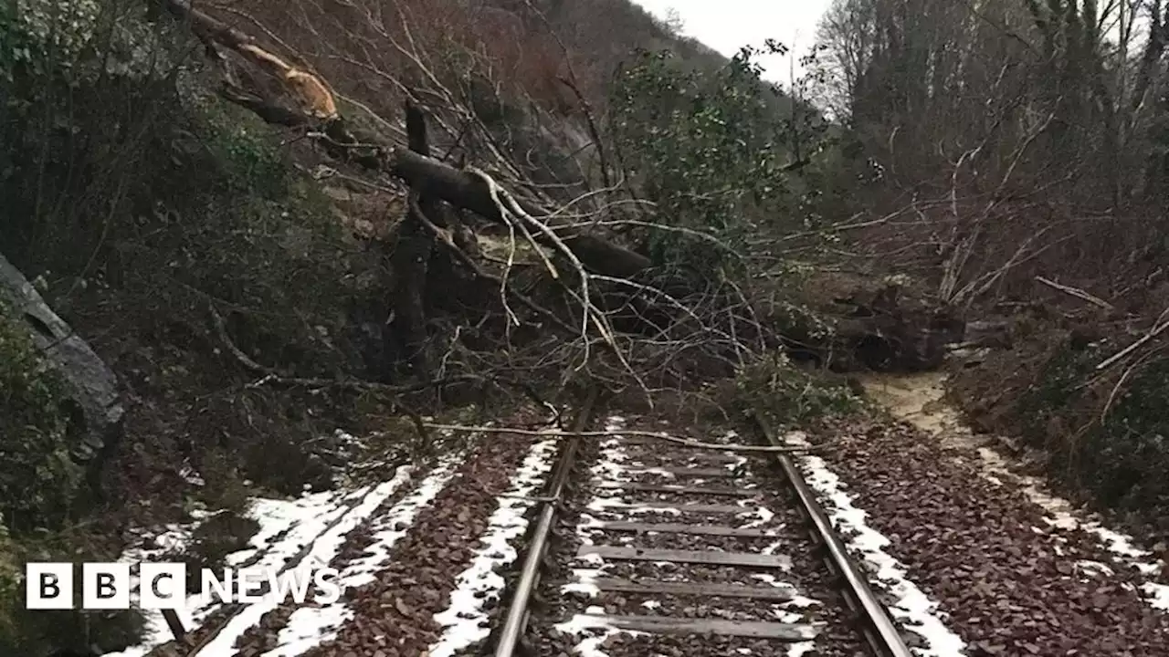 Suspected landslip shuts road and rail line