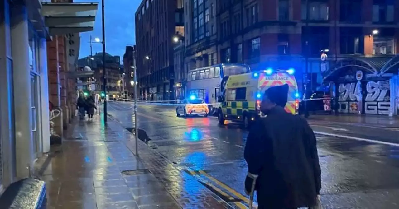 Paramedics race to scene after woman hit by bus in Manchester city centre