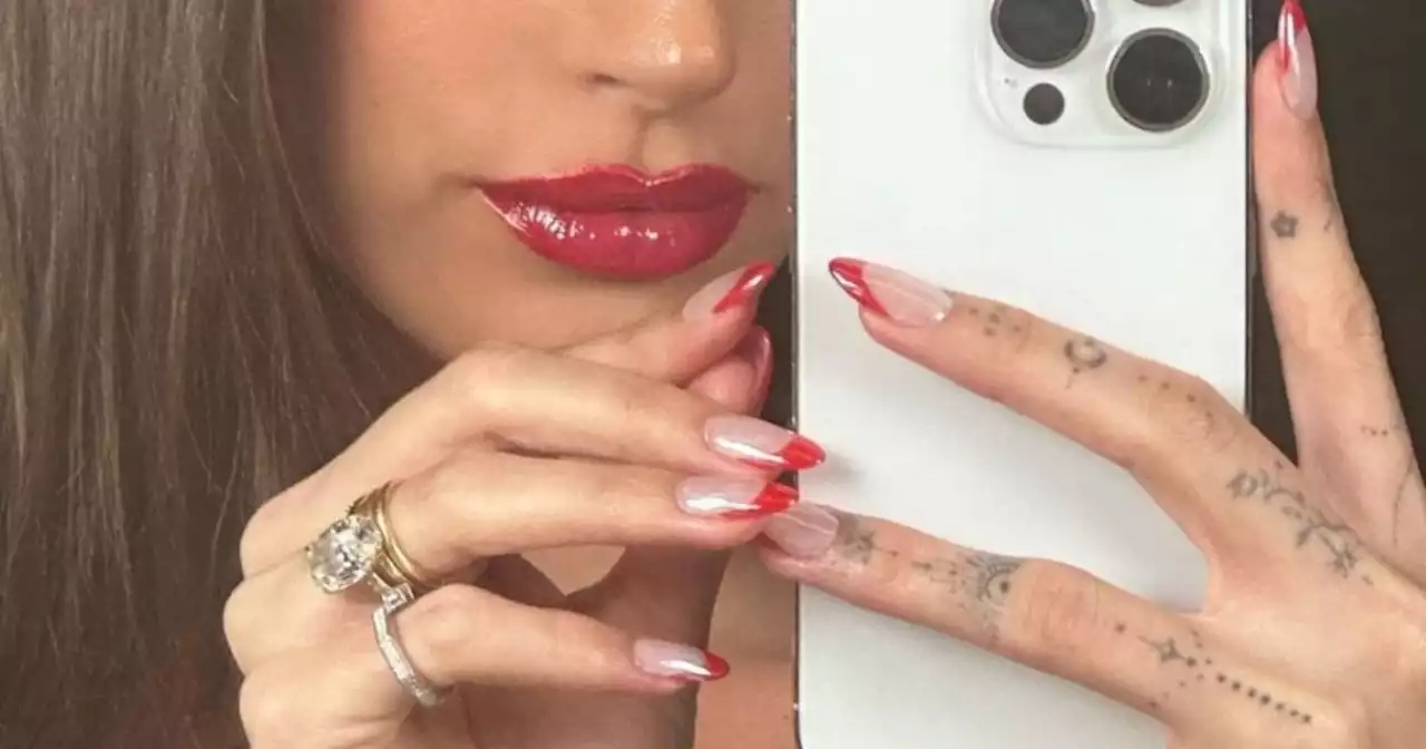 Hailey Bieber starts a new festive manicure craze with ‘glazed candy cane' nails