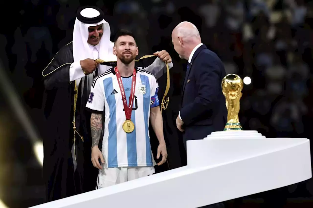 Lionel Messi made to wear Qatari cloak to lift World Cup trophy