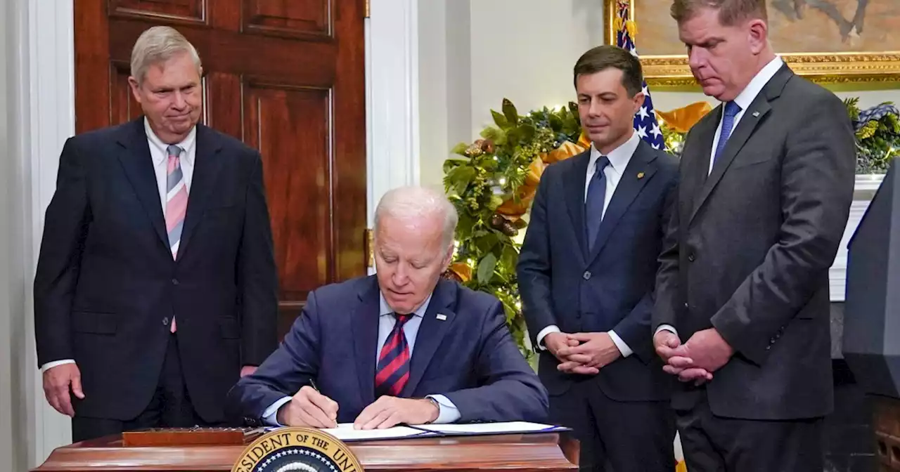 Biden signs legislation to avert rail strike