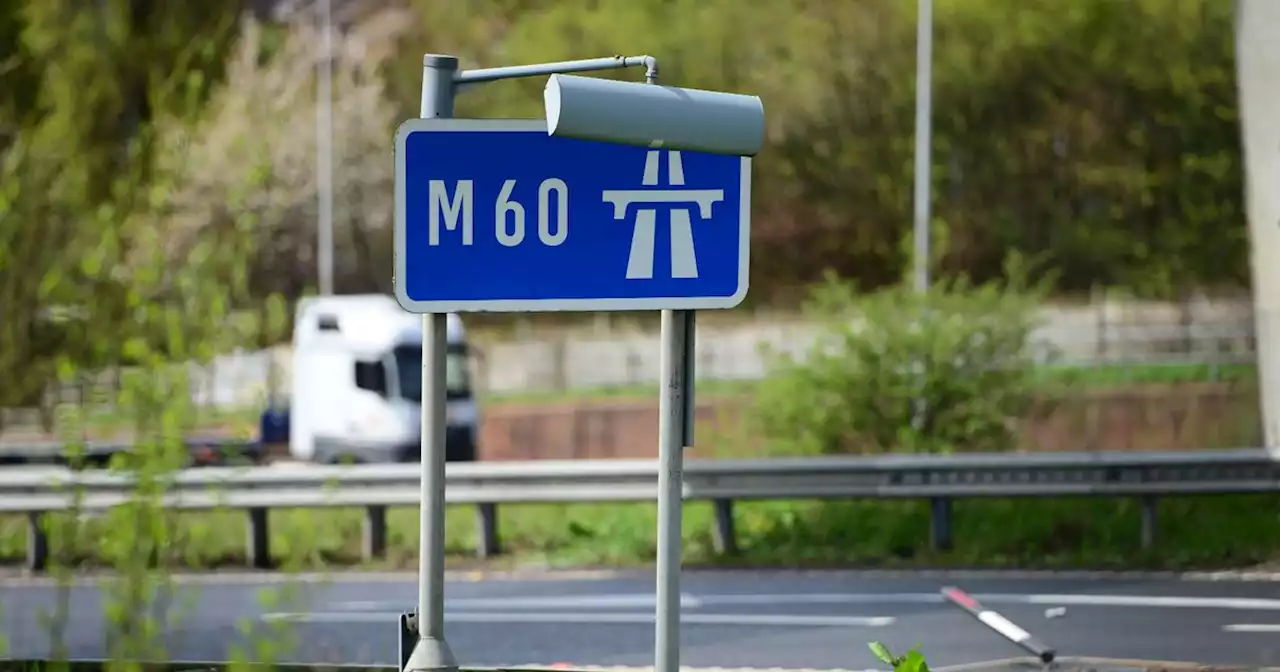 Man 'on wrong side of railings' on bridge over M60 brought to safety