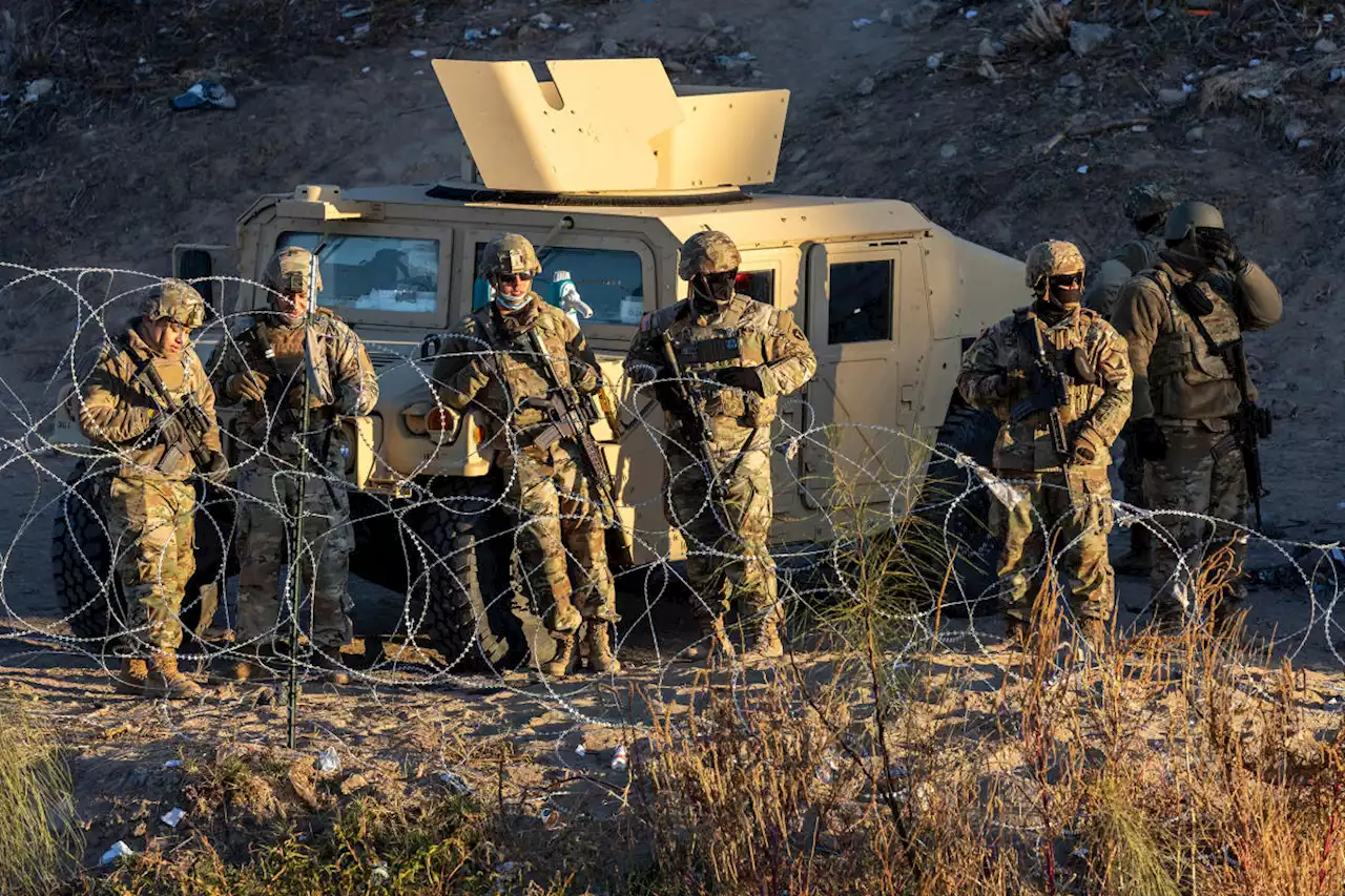 Armed Texas National Guard makes show of force on border to turn back migrants