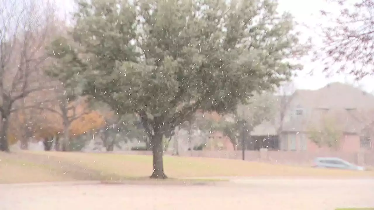 Snow falls as temperatures drop across North Texas