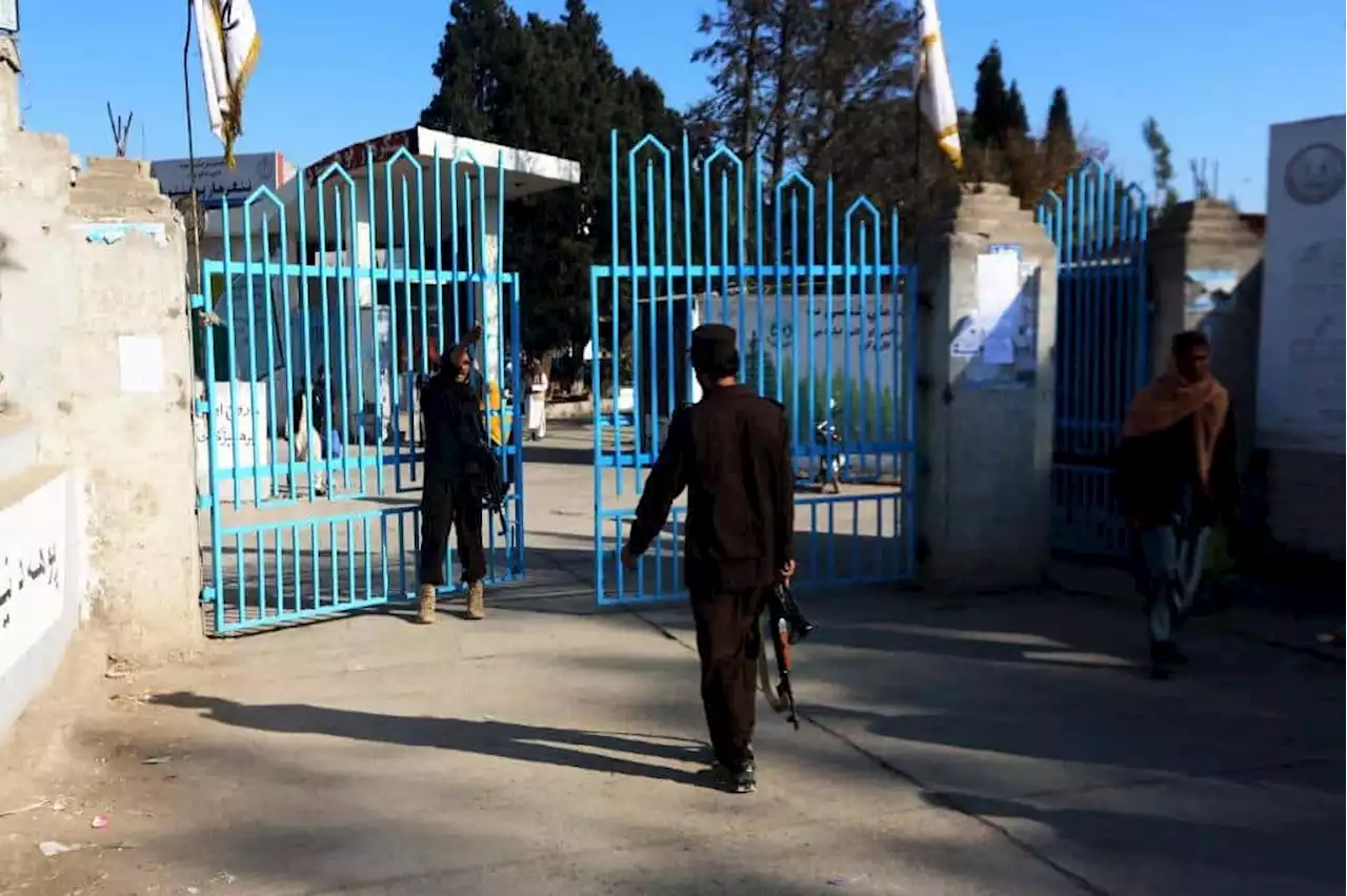 Armed guards stop Afghan women entering universities after Taliban ban