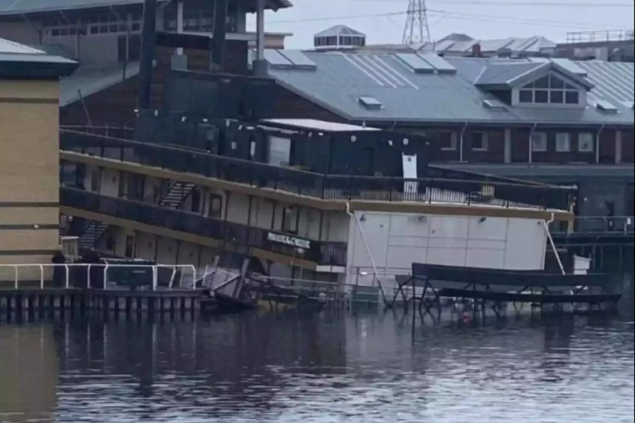 Miller and Carter restaurant SINKS on shopping mall lake in dramatic pics