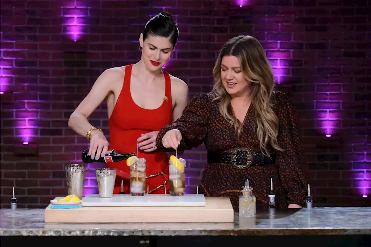 Alexandra Daddario Shakes Things Up in Fiery Red Midi Dress on ‘The Kelly Clarkson Show’