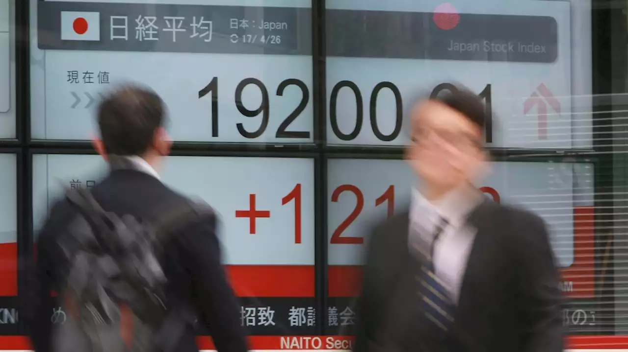 Asian shares higher in thin holiday trading