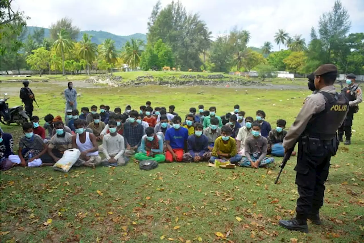 58 weak Rohingya Muslims land on Indonesian beach after weeks at sea