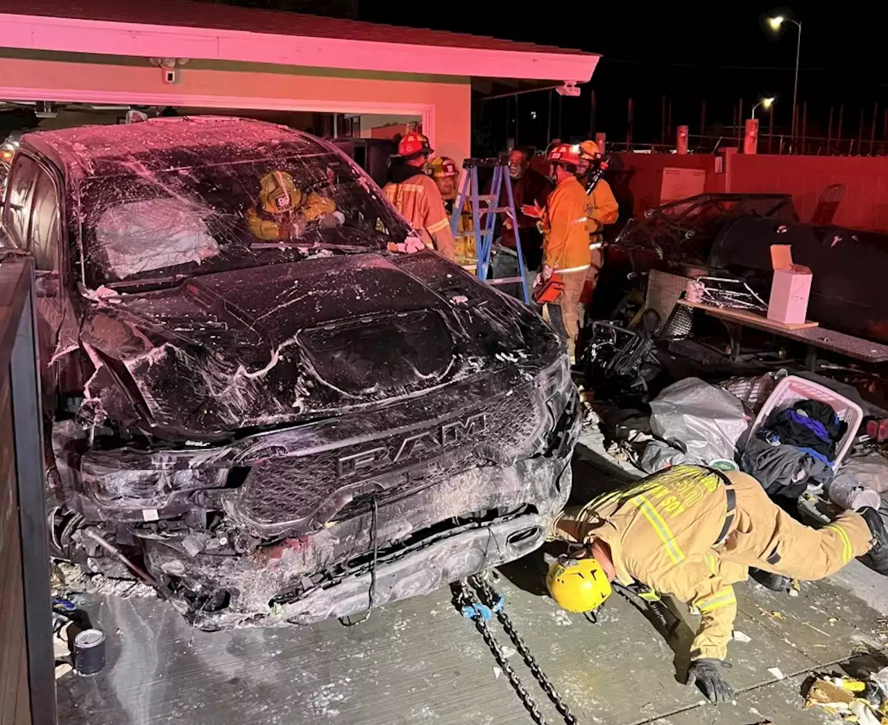 Truck crashes into home’s garage, driver flees in Granada Hills