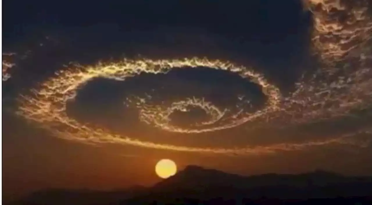 Does This Photograph Show a Large Spiral Cloud Forming at Sunset?