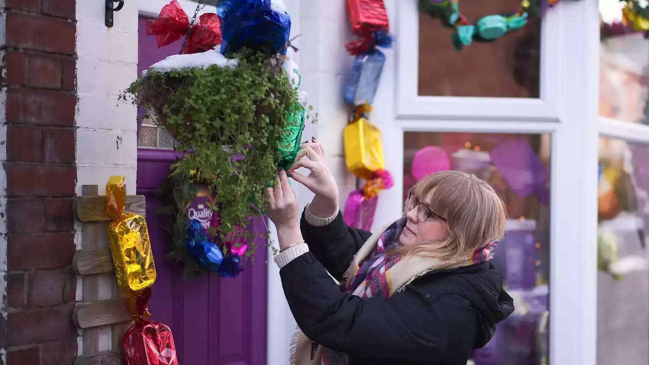 Locals decorate homes with giant Quality Streets to raise cash for food banks