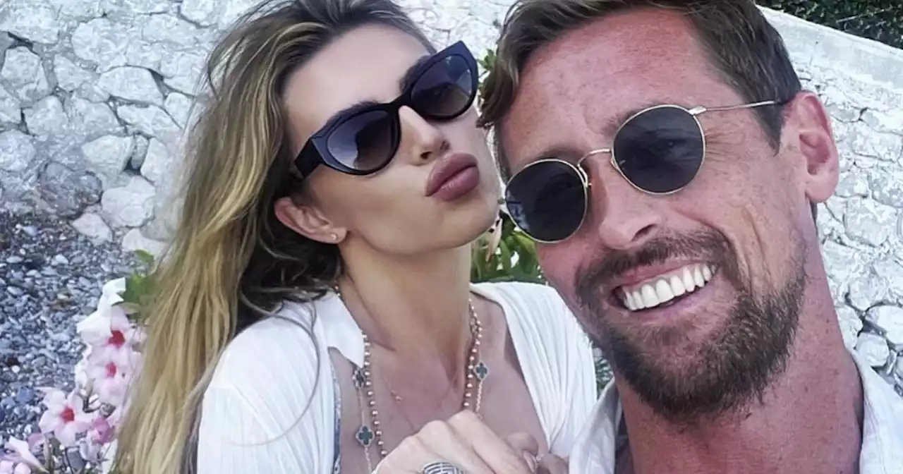 Abbey Clancy shows off toned figure and flashes peachy derrière in tiny bikini