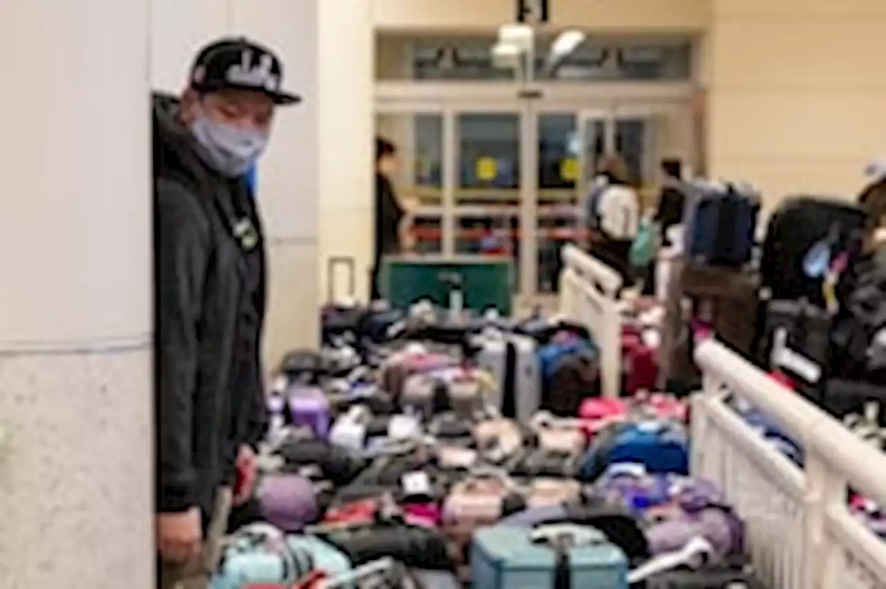 Chaotic holiday travel weekend leaves mountains of lost luggage in airports