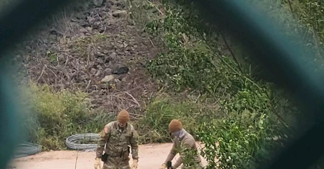 EXCLUSIVE PHOTOS: Texas Guardsmen Place Razor Wire on Rio Grande Bank