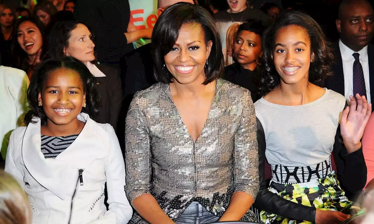 Barack and Michelle Obama's daughters make rare appearance in celebratory family photo