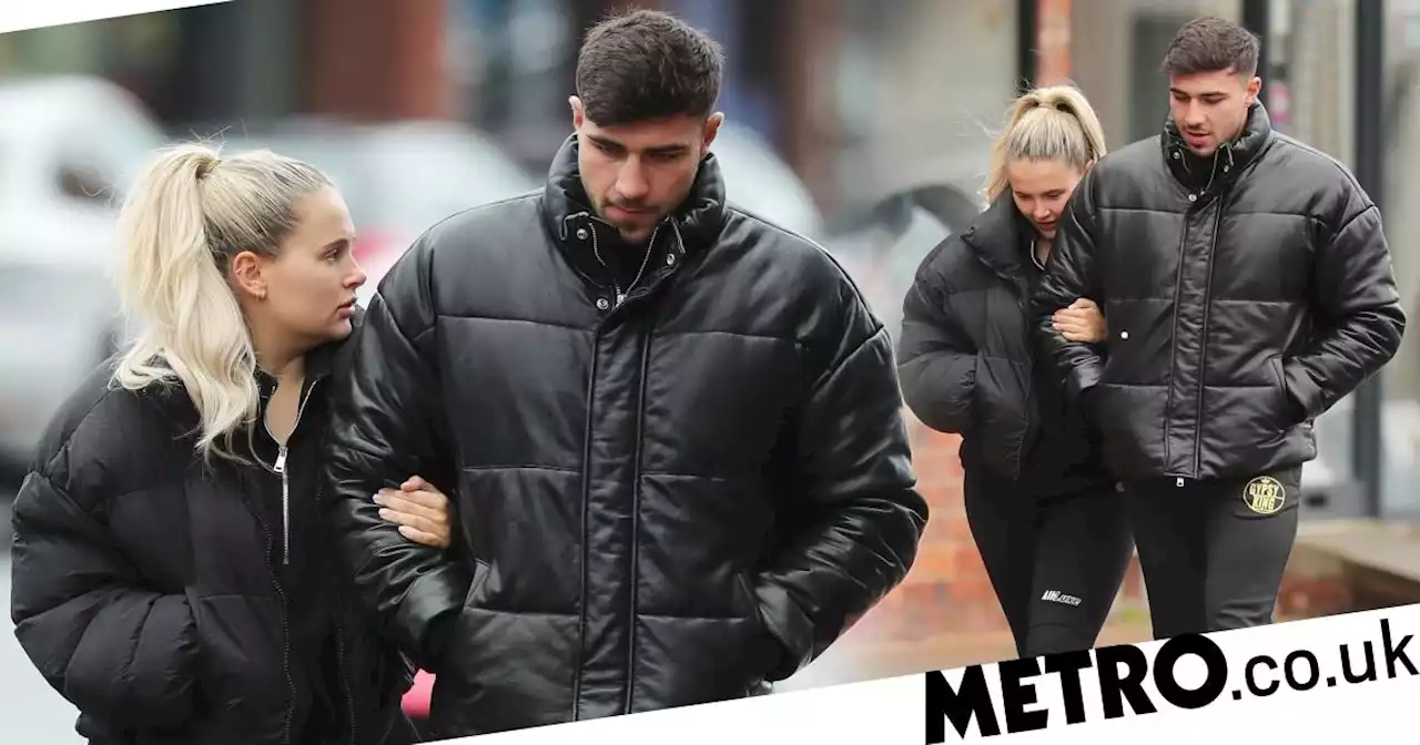 Molly-Mae Hague and Tommy Fury lock arms in matching outfits ahead of due date