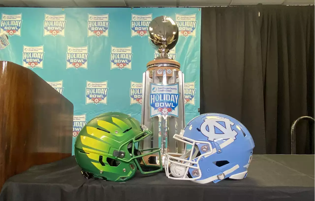 Oregon, UNC's Marching Bands Perform at San Diego Landmarks Ahead of Holiday Bowl