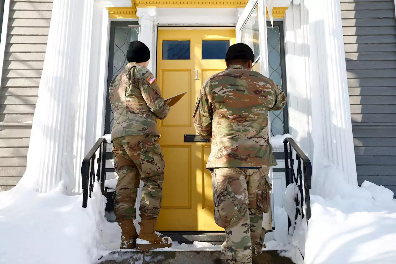 National Guard Checks Homes In Buffalo For Blizzard Victims