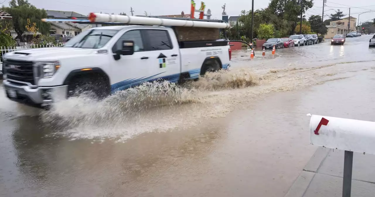 What is an atmospheric river, responsible for the heavy rainfall on the West Coast?