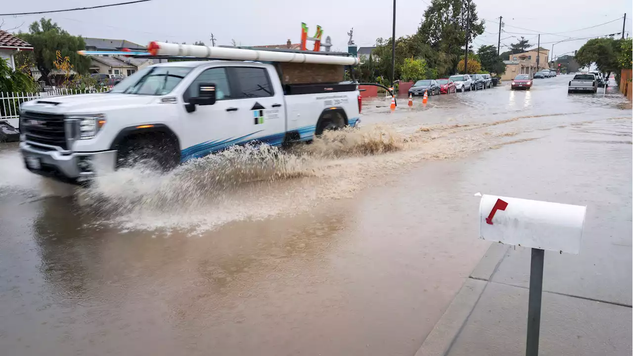 What is an atmospheric river, responsible for the heavy rainfall on the West Coast?