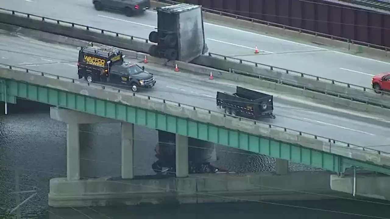 Cleanup underway after UPS truck dangles over bridge on Indiana Toll Road, catches fire