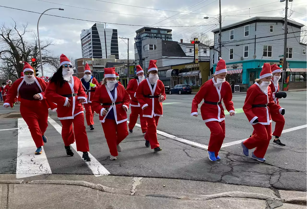 IN PICTURES: 101 Santas take to the sidewalk in Halifax for charity run | SaltWire