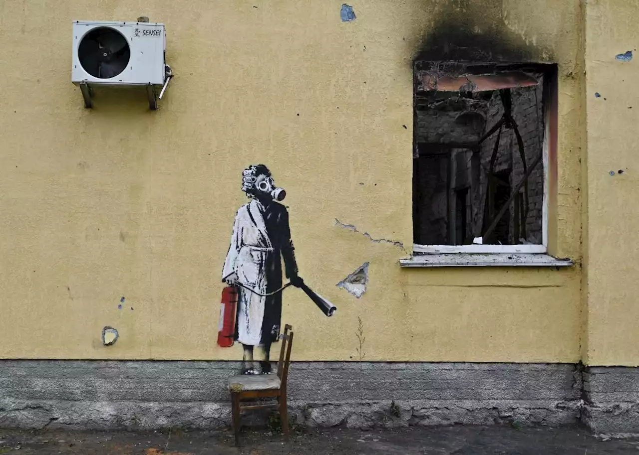 Thieves try to steal Banksy mural from scorched wall in Ukrainian town