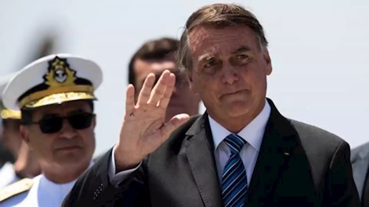 Tearful Bolsonaro leaves Brazil for US, avoiding presidential handover