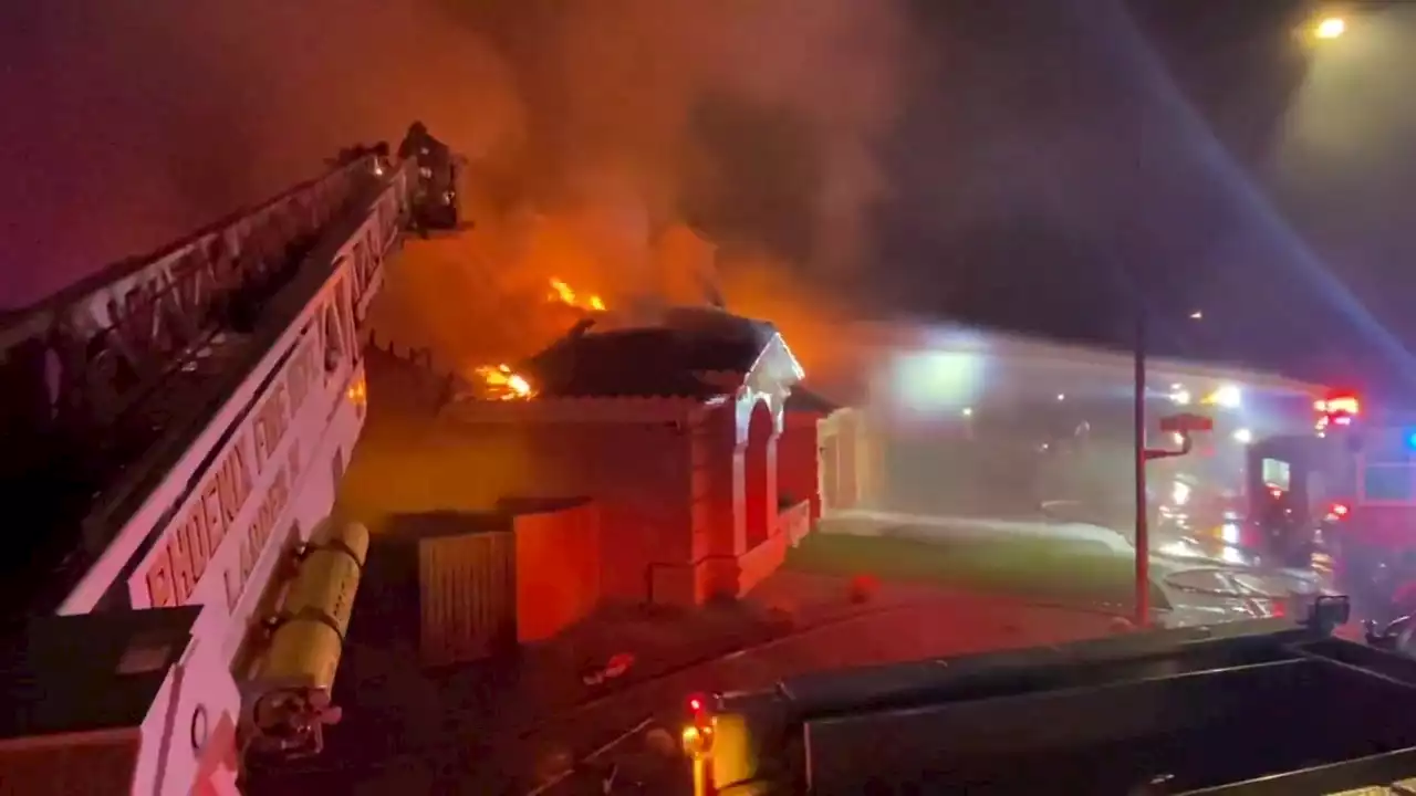 Phoenix, Scottsdale firefighters knock down flames coming from a home's roof