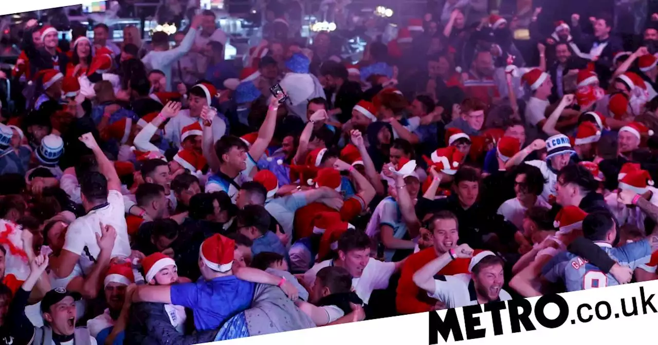 Packed pubs go wild as England fans in Santa hats celebrate Three Lions goals