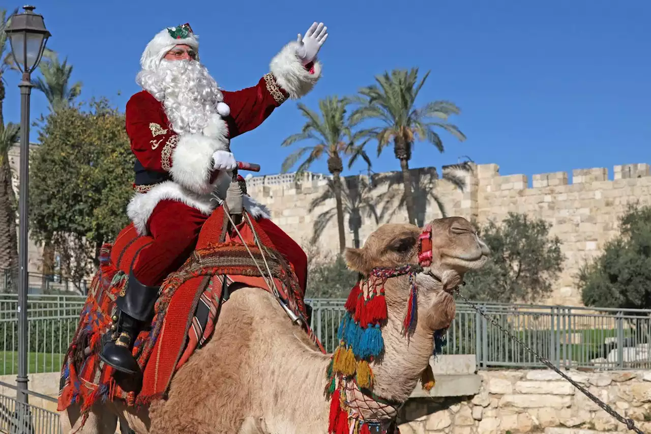 In pictures: Palestinian Santa brings festive cheer to Jerusalem