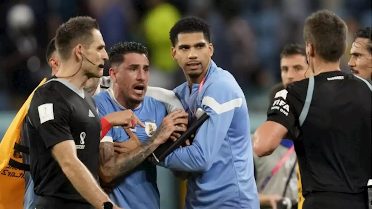 Uruguay players charged for confronting World Cup referee