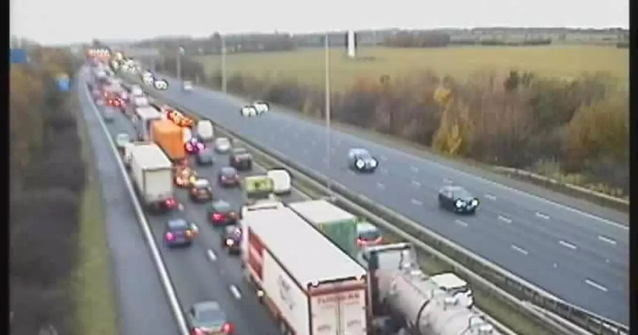 Motorway crash chaos as traffic held and drivers stuck in miles of delays - live