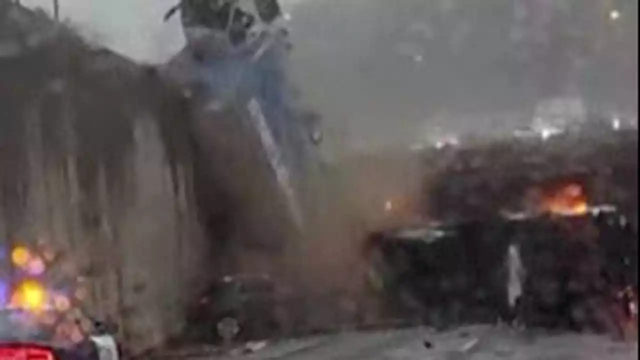 Dramatic video captures truck toppling over California freeway overpass