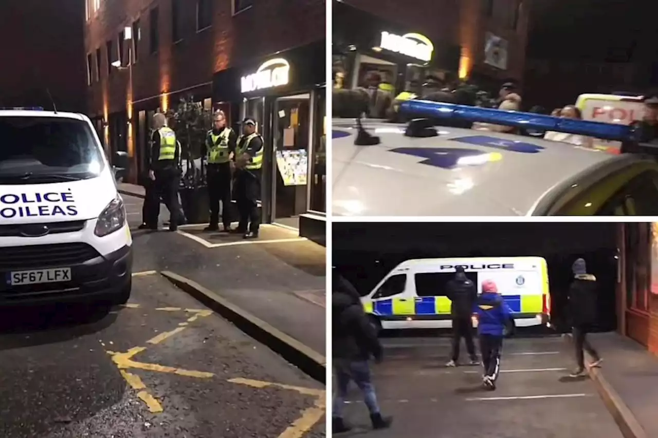 Man taken away by cops after angry protestors gather in Paisley