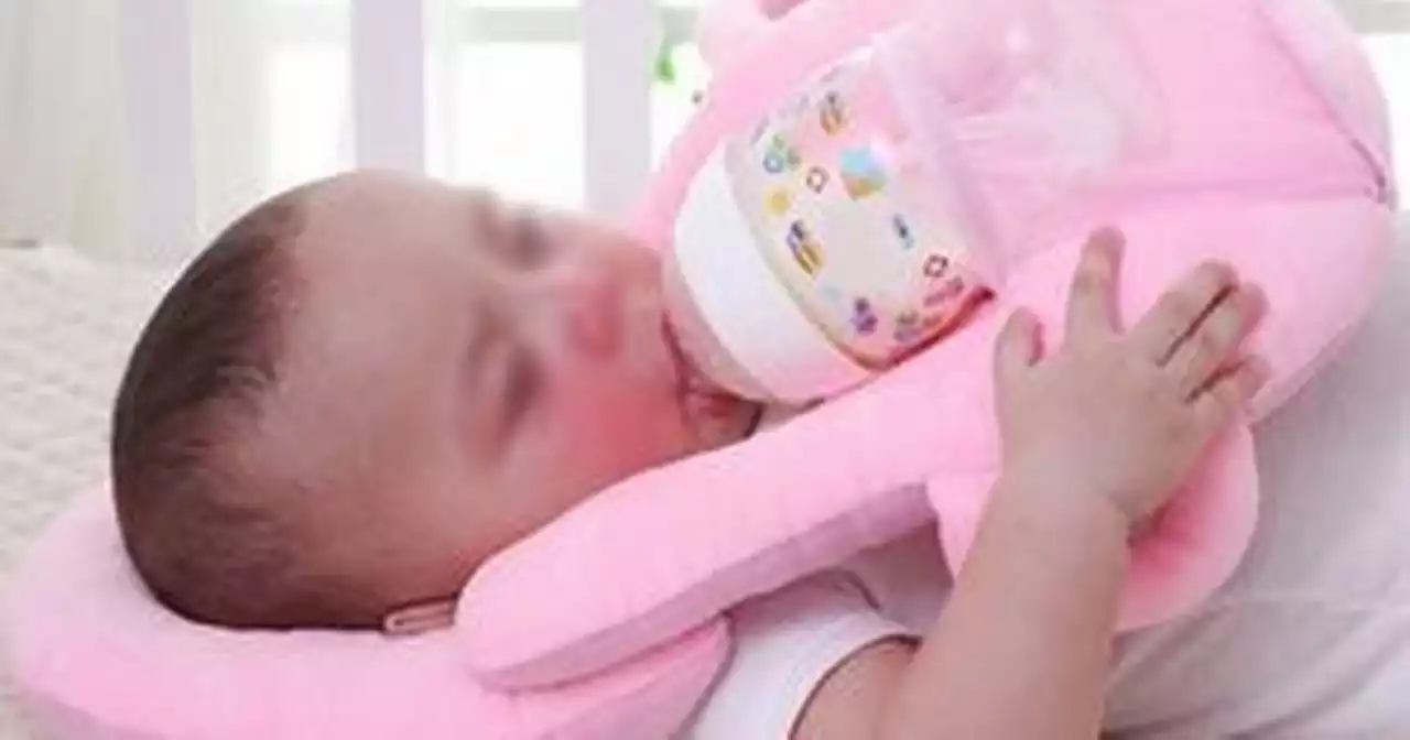 Safety warning to parents over 'extremely dangerous' baby self-feeding pillows