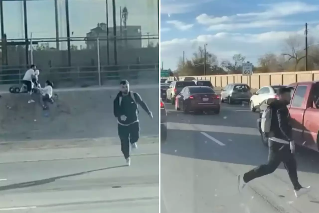 Dramatic video shows immigrants easily hop border wall in Texas, narrowly avoid highway traffic