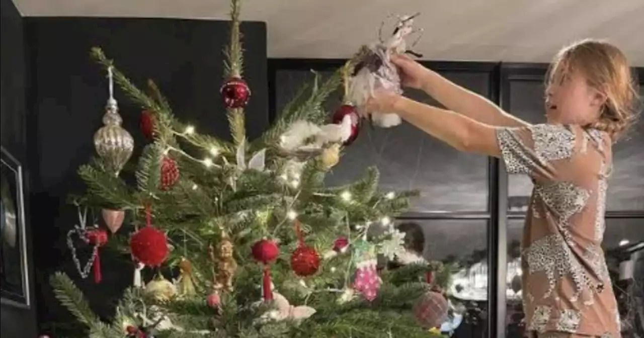 Amanda Holden shows off huge Christmas tree with daughters at London home