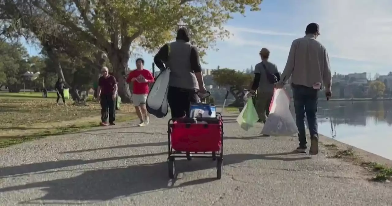 Group of volunteers bonds over cleaning up trash around Oakland's Lake Merritt