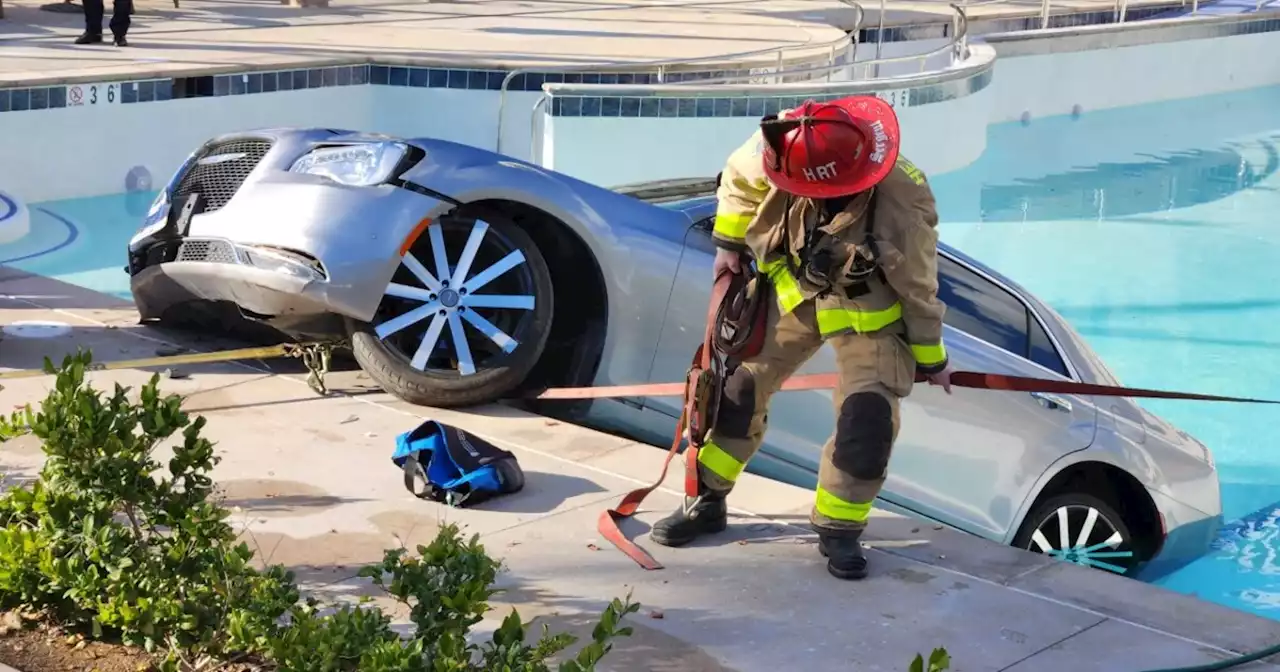 Crews rescue woman after car ends up in pool at senior complex in Spring Valley