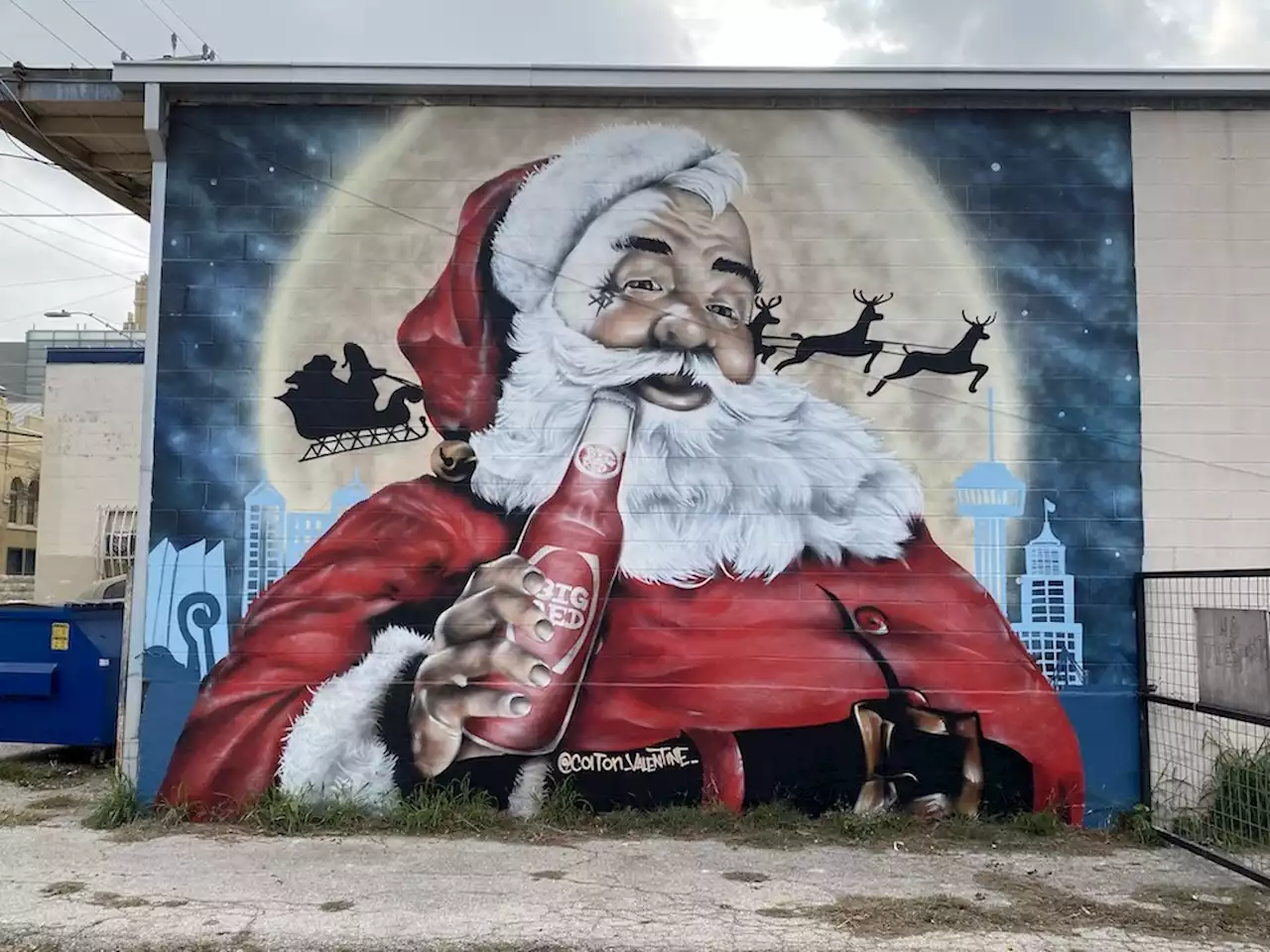 San Antonio muralist Colton Valentine unveils portrait of Big Red-swigging Santa Claus