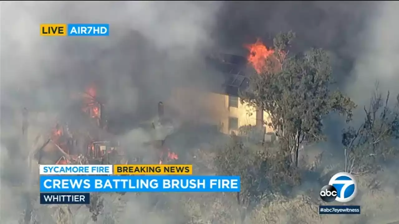 Fast-moving brush fire rips through at least 2 homes near Sycamore Park in Whittier