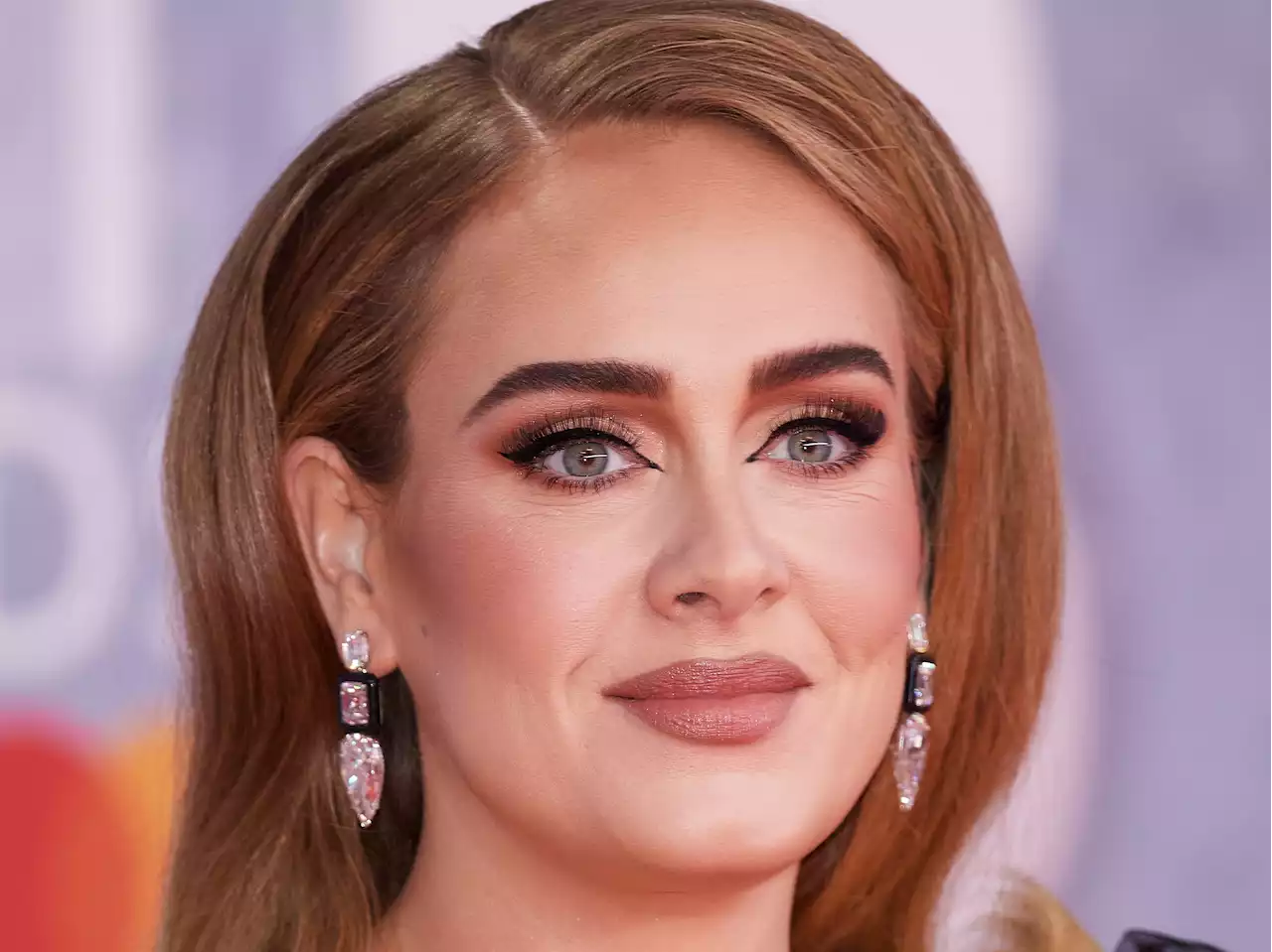 Adele hits back at critics who twisted her Brits speech during GAY appearance